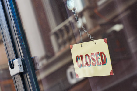 A Closed sign on the shops door means the business is not open for customers now