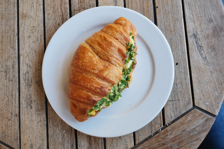Sandwich With Smoked Chicken Salami on table