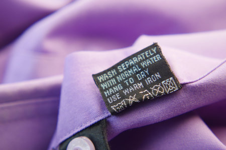 Clothing label with care symbols on a clothの写真素材