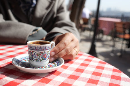 woman drinking turkish coffee at cafeの写真素材