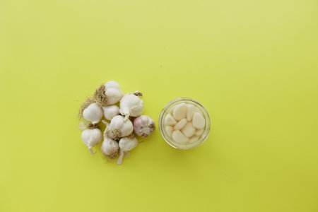 top view of garlic on yellow background,の写真素材