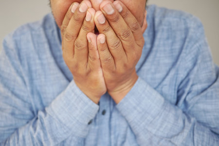 Sick man got flu allergy sneezing and blowing noseの写真素材