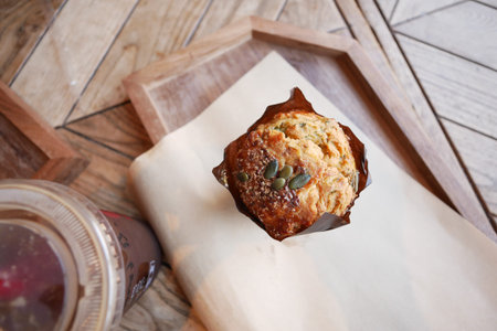 Savor the delightful combination of a tasty muffin and a steaming cup of coffee