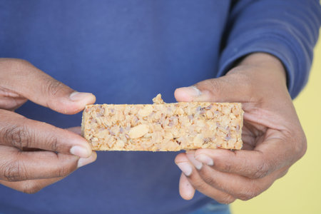 hand holding a oat protein bar