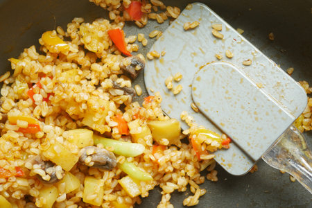 Explore cooking StirFried Rice with Vegetables in a wok, a homemade vegetarian gourmet recipeの写真素材