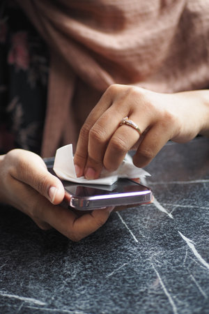 cleaning mobile phone display for preventing virusの写真素材
