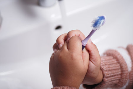 A Child Brushing Their Teeth at the Bathroom Sink is an important daily hygiene activity