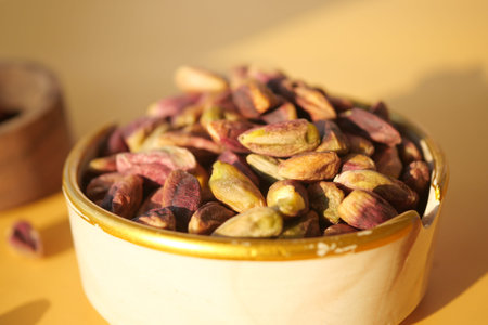 a bowl filled with pistachios, a natural and nutritious superfoodの写真素材