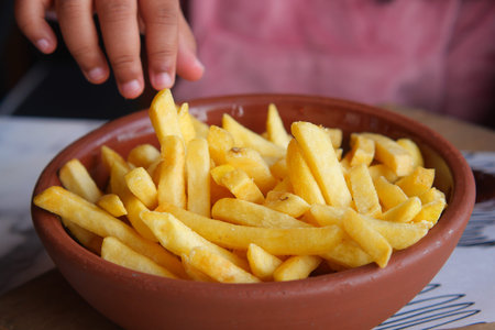 child eating french fries close up