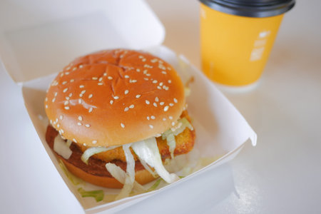 beef burger in a take away box on tableの写真素材