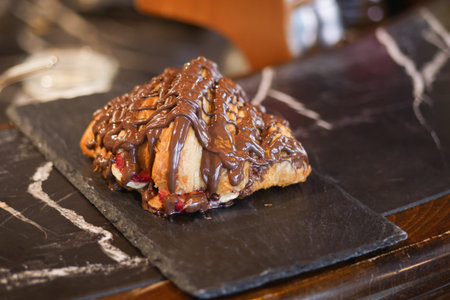 cream and chocolate on croissantの写真素材