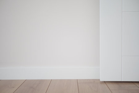 A modern interior with light walls and wooden floors, offering a comfortable, stylish atmosphereの写真素材