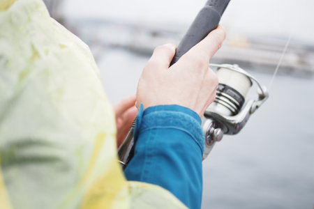 Fisherman with rod, spinning reel ,の写真素材