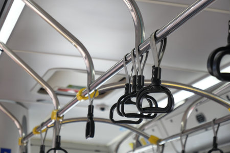 An Interior View Highlighting the Handrails and Grab Bars of a Public Bus for Safety