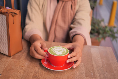 Cozy Coffee Moment Charming and Stylish Latte Art Captured in a Lovely Cafe Settingの写真素材