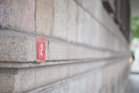 house number. Decorative lettering on a brick wall.の写真素材