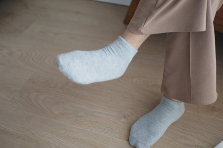 Embracing a Cozy Indoor Lifestyle A Relaxing Day with Grey Socks and Casual Trousers