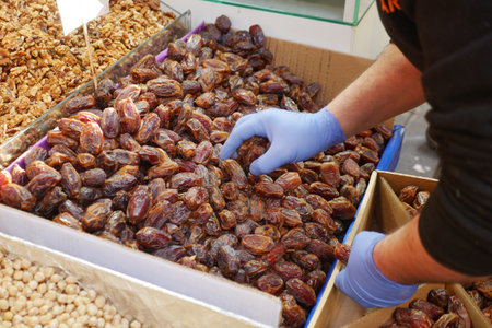 Explore the exquisite selection of fresh dates at a charming market stall todayの写真素材
