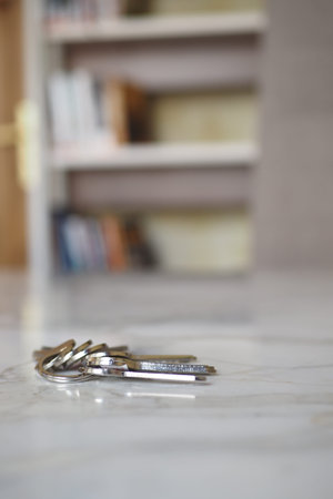 house keys on the ring on table in a room. To forget keys at home concept ,