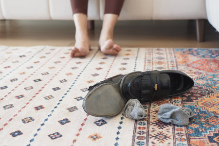 dirty sock and shoe on floorの写真素材