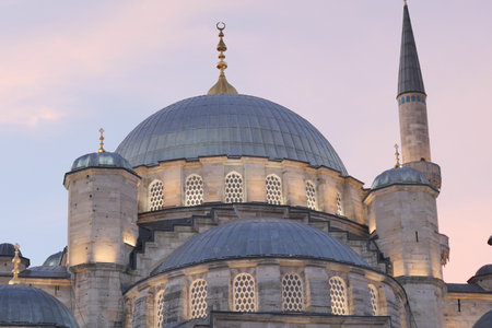 Stunning Architectural Detail of a Beautiful Mosque Captured at Sunset During Evening Hoursの写真素材