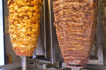 Delicious Shawarma is Rotating on Skewers in a Restaurant, a Culinary Delight to Enjoyの写真素材