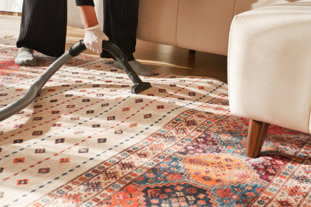 women cleaning a carpet with vacuum a cleaner,の写真素材