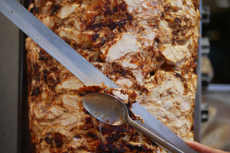 Close-Up of Juicy Shawarma Meat Being Slicedの写真素材