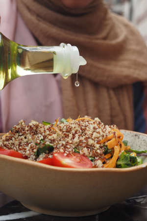 Delicious Fresh Salad Prepared with Quinoa and a Light Drizzle of Olive Oil on Topの写真素材