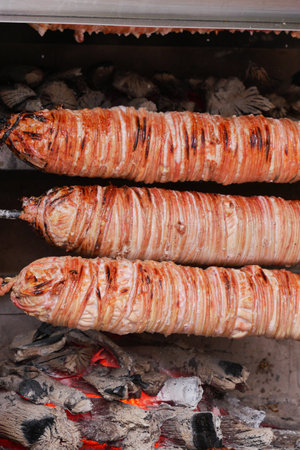 Grilled Delicacies Enjoying Succulent Meat Wrapped Elegantly in Crispy Layers over Charcoalの写真素材