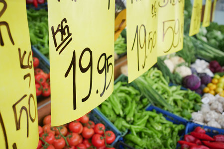 Explore Fresh Market Produce with EyeCatching Price Tags Displayed in Vibrant Colorsの写真素材