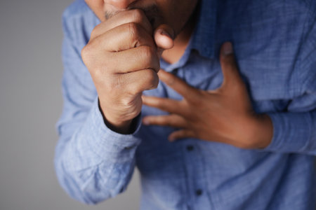 Sick man got flu allergy sneezing and blowing noseの写真素材