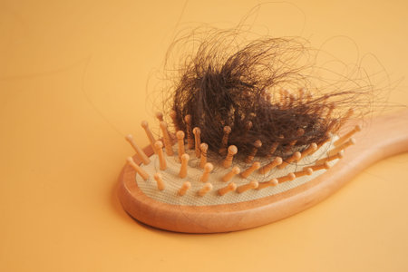 a brush with lost hair on table