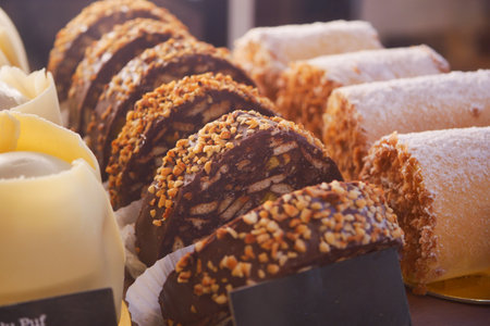 A Delicious and Enticing Assortment of Pastries and Exquisite Chocolates Displayed Beautifullyの写真素材