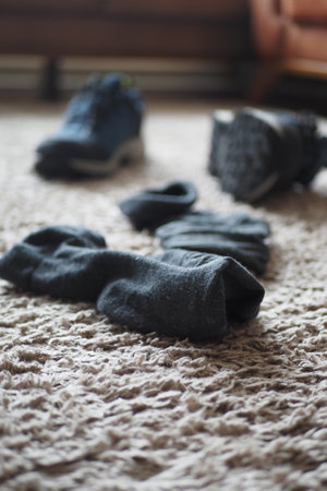 dirty sock and shoe on floor