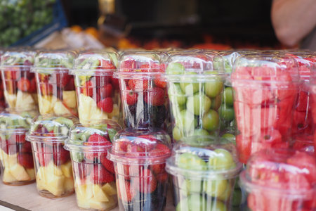 strawberries in plastic container selling at shopの写真素材
