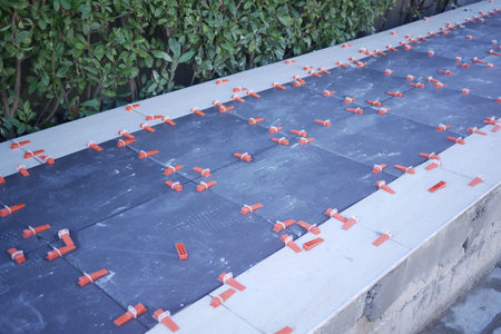 Recently Installed Black Tiles with Spacers on the Outdoor Surface for Enhanced Design