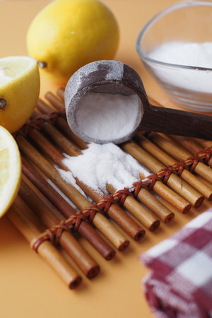 Baking soda and whole lemon on tableの写真素材