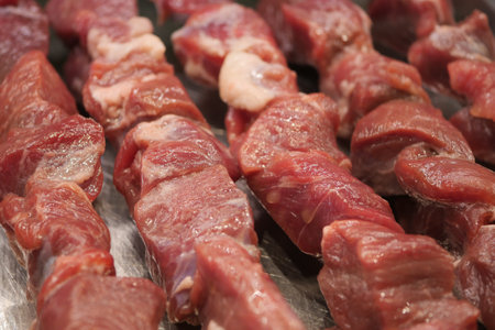 Deliciously Freshly Cut Raw Meat Skewers Perfectly Prepared and Ready for Grilling Anytimeの写真素材