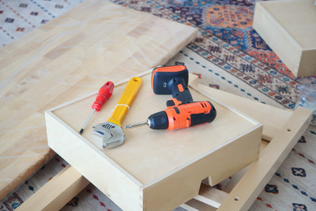 Essential Tools Required for DIY Furniture Assembly on a Beautiful and Stylish Rug Surfaceの写真素材