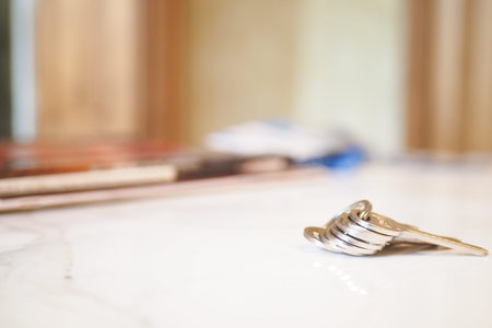 house keys on the ring on table in a room. To forget keys at home concept ,