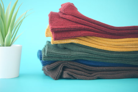 Explore our vibrant and colorful socks collection showcased beautifully on a mint background
