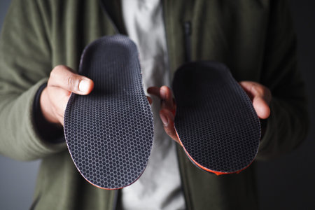 Visual comparison of two shoe insoles showcasing design and texture differences