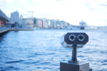 Binoculars looking out over cityの写真素材