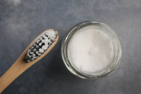 A bowl of baking soda, a bamboo toothbrush,の写真素材