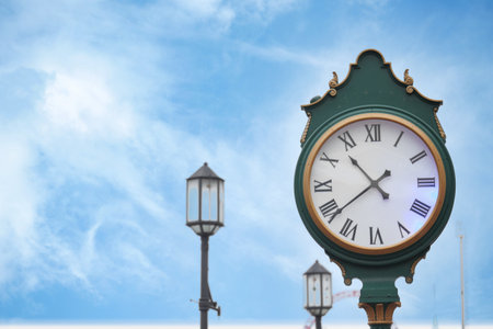 An Elegant Street Clock Displayed Beautifully Against a Clear Blue Skyの写真素材