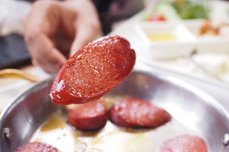Sausages that are cooked to perfection and beautifully plated for servingの写真素材