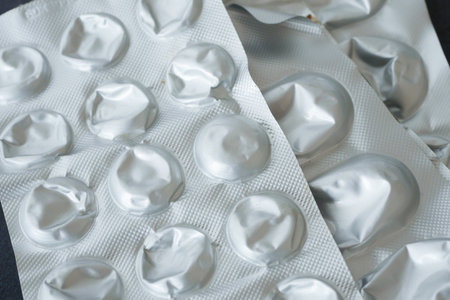 A CloseUp Image Featuring Empty Blister Packs of Various Medicationsの写真素材