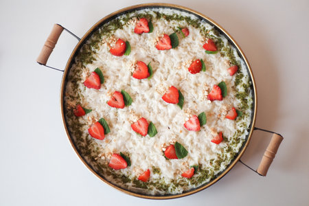Delicious dish with fresh strawberries and a cheese toppingの写真素材