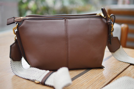 Stylish Brown Leather Handbag Featuring a Convenient Shoulder Strapの写真素材